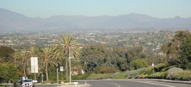 a view of street with mountains