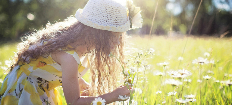a girl picking flowers