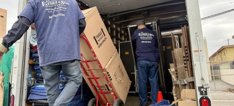 two men loading a moving truck during a residential move in LA