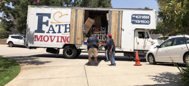 two long distance movers los angeles loading a moving truck