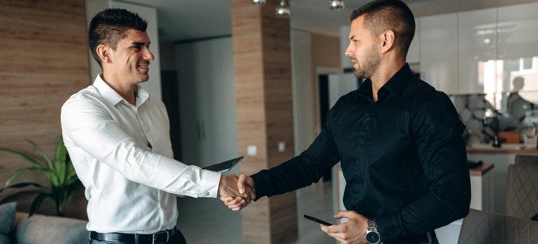 men shaking hands to show trust and agreement.