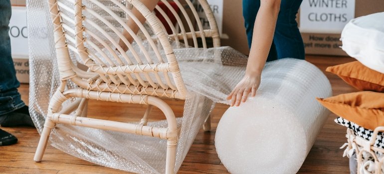 Person Using Bubble Wrap On A Chair