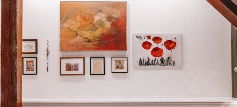 White counter with framed pictures