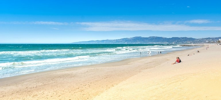 People relaxing at a sandy beach near the cities in the San Fernando Valley.