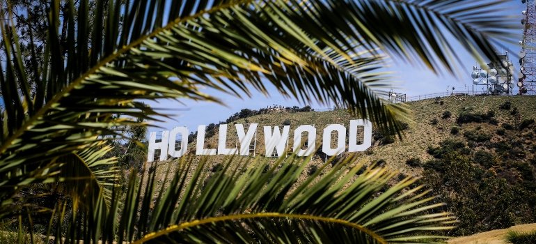 Distant view of Hollywood sign , representing nearby attractions and things to do in Burbank.