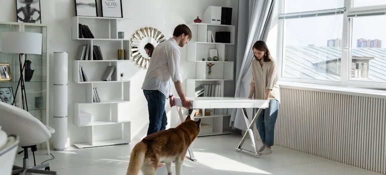 Couple Moving White Desk