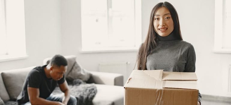 Woman Holding Moving Box