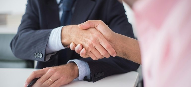 Close-up of Shaking Hands Between Men