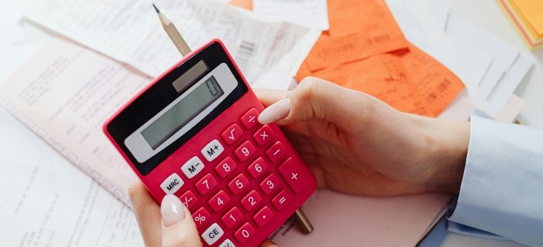 Woman calculating the cost of living in Pasadena California