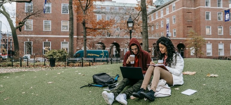 Man and Woman Studying at a Park
