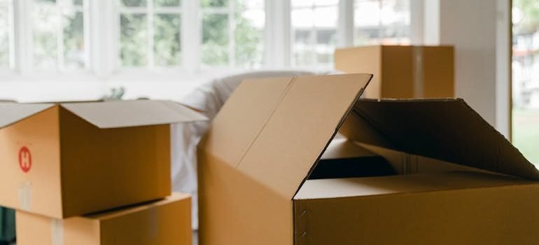 Unpacked boxes in middle of room