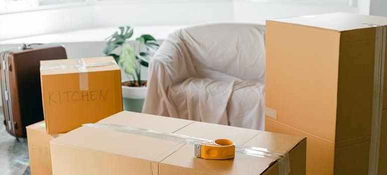 Empty apartment with packed carton boxes before moving