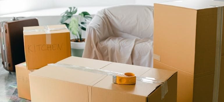 Empty apartment with packed carton boxes before moving