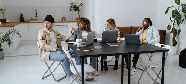 People Sitting at the Table Having a Meeting