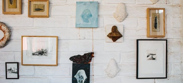 Framed pictures hanging on wall