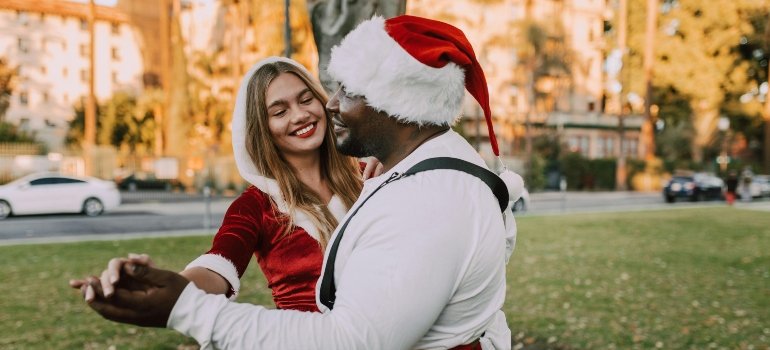 Couple celebrating Christmas outdoors in California’s mild, sunny, and dry winter weather.