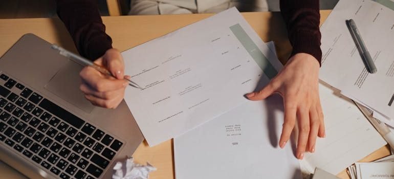 Person Holding White Document Paper