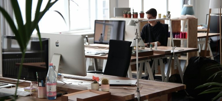 Man Sitting in Front of Computer in the office.