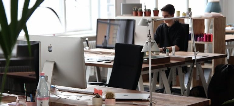 Man Sitting in Front of Computer
