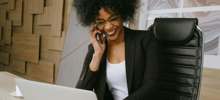 Woman In Black Blazer Sitting On Black Office Chair