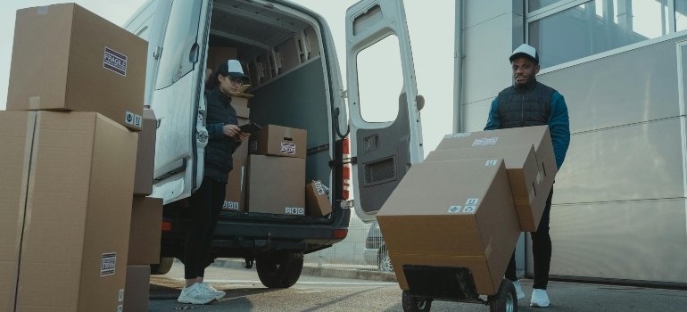 A Man and a Woman Working for a Moving Company